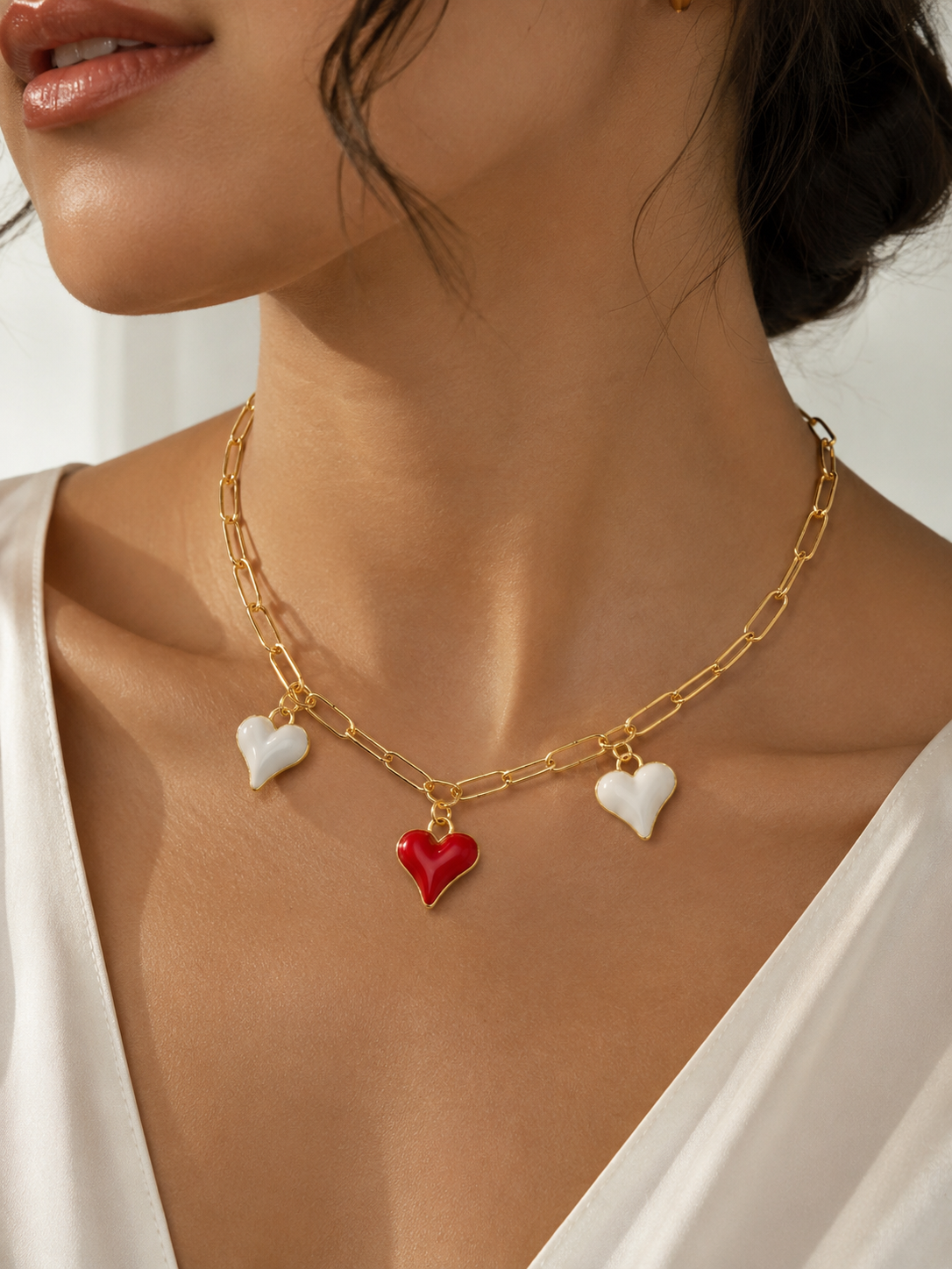Collar triple corazón baño de oro