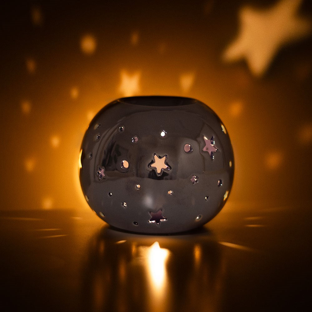 Quemador para aceite y cera en color iridiscente/tornasol morado con estrellas