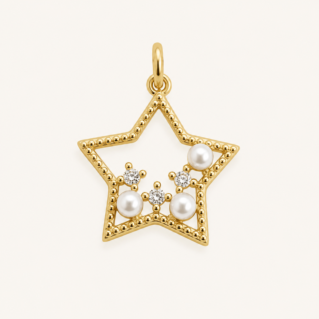 Dije estrella con tres circones y perlitas