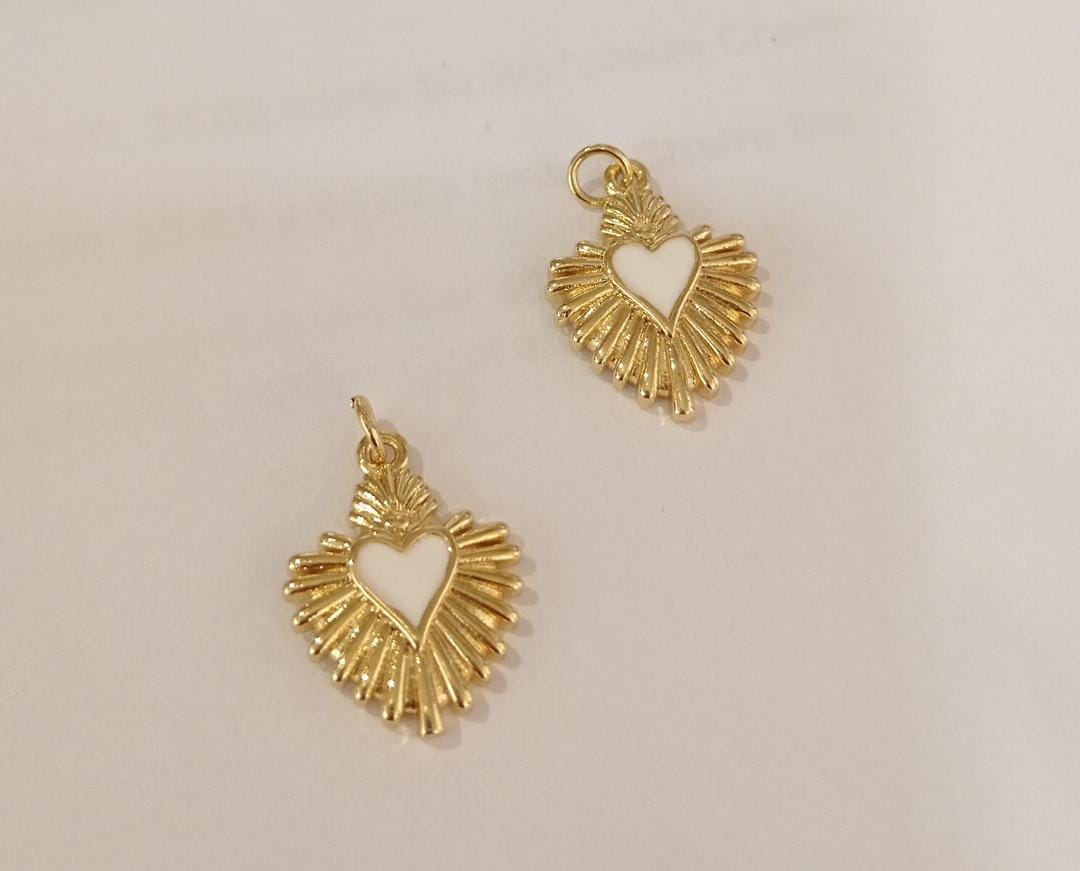 DIJE MIINI CORAZON DE JESUS BLANCO CON DESTELLOS