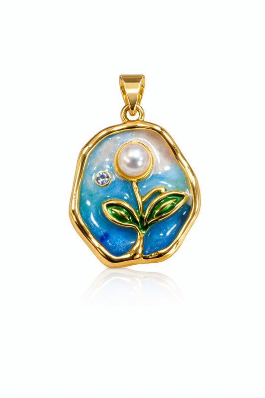 DIJE DE MEDALLA FONDO CELESTE CON FLOR Y PERLA EN CENTRO