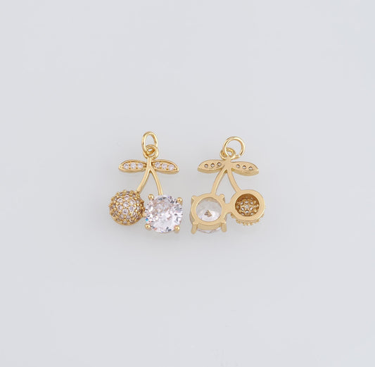 DIJE CEREZA DORADA UN LADO DE CIRCONES UN LADO CRISTAL