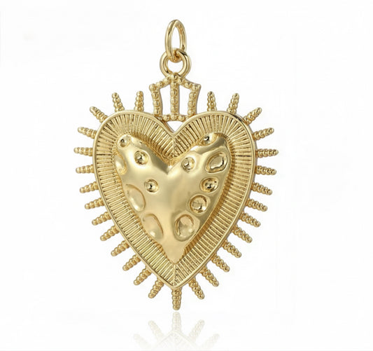 DIJE CORAZON DE JESUS DE TEXTURA EN EL CENTRO Y BORDE DE PUNTAS