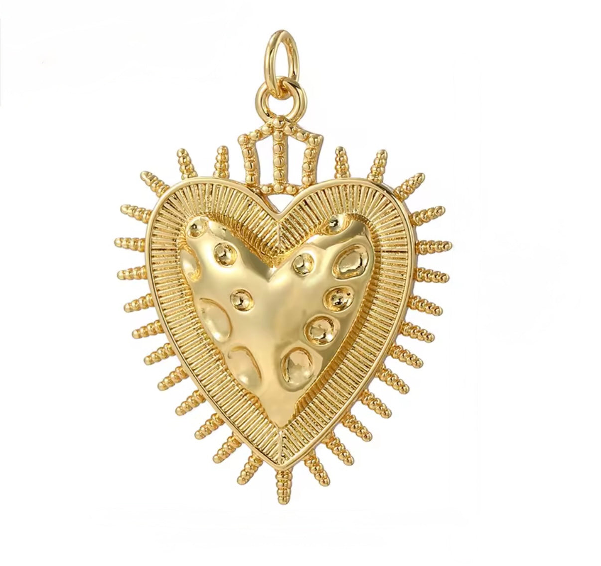 DIJE CORAZON DE JESUS DE TEXTURA EN EL CENTRO Y BORDE DE PUNTAS